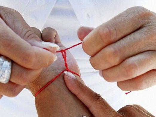 How to tie a red thread?